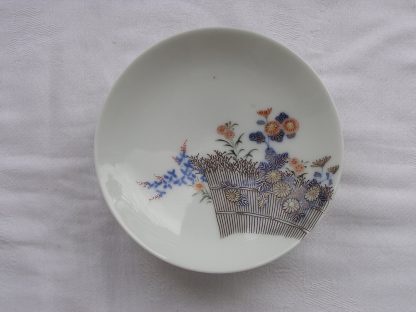 Small Koransha plate with fence and flowers, 1912-1926